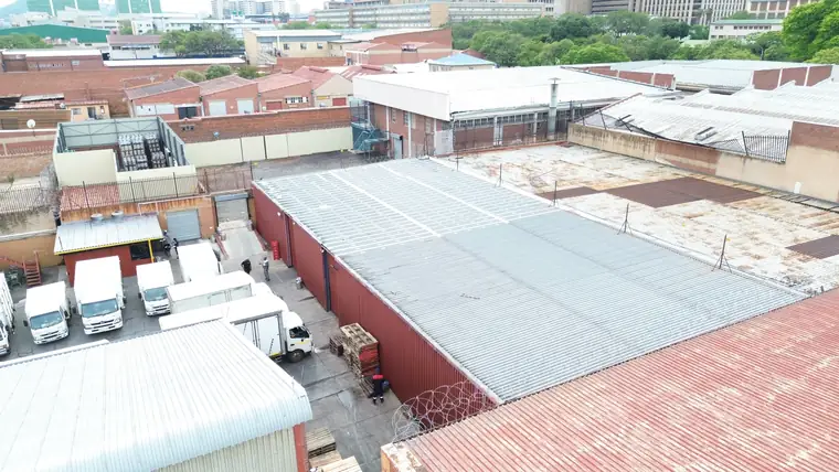Industrial precinct from the air with warehouse roofs and loading bays